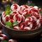 close photo of candy canes and mint leaves in a bowl