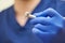 A close photo of a hand of a dentist who holds a dental diamond drill