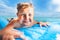 Close portrait of a boy swim on matrass in the sea