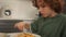 Close portrait kinky boy teenager having lunch at home. Schoolboy eats spaghetti Italian pasta. Healthy eating, teenage