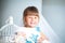 Close portrait of a little girl in a magnificent evening dress