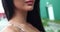 Close portrait of unrecognizable brunette's naked shoulder and seductive lips