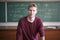 Close portrait of young bearded professor teacher in casual with blackboard with formulas behind