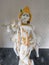 Close potrait photo of beautiful white statue of lord Krishna in the temple of konkan.