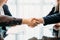 Close seal deal business partner shaking hands