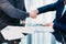Close seal deal business partner shaking hands