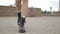 Close shot of female legs walking in heavy armi boots. Closeup shooting fashionable female in leather boots walk in