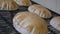 Close of shot of freshly baked arabic breads on conveyor. Arabic bread