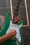 Close shot of a green guitar being played by a musician