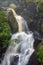 Close shot of a waterfall streaming from the mountain. Long exposure of a waterfall.