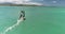 Close shot of windsurfer in turquoise water, slow motion