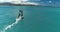 close shot of windsurfer in turquoise water, slow motion, color graded