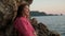 Close shot of woman face on shore of lake, looking on landscape