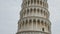 Close tilt up shot of the leaning tower of pisa