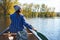 Close to the sea is where she loves to be. a young woman going for a canoe ride on the lake.