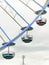Close-up on 3 Gondolas of a ferris wheel with blue light