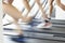 Close Up Of 3 Runners Feet On Running Machine In Gym