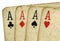 Close up 4 old vintage dirty aces poker cards.