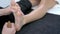 Close-up 4K video of woman enjoying thai foot massage in professional salon