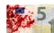 Close-up of a 5 euro bank note, stained with blood