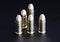 Close up of 9 mm golden pistol bullets ammo on background