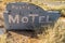 Close up of an abandoned generic rustic retro motel sign is fall