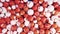 Close up of abstract colorful red and white plastic balls with hearts signs falling into a pile. Animation. Concept of