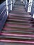 Close-up of abstract metal staircase with backlight with blur / side effect.