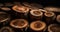 Close up of an abstract pattern with round woodpiles. View of a pile of wooden logs.