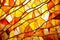close-up of an abstract stained glass design in warm tones