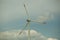 Close up abstract view of a giant wind turbine with blue sky