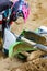 Close-up of accident in mountain bikes race in dirt track with flying debris during an acceleration