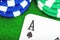 Close-up of the ACE of green and blue poker chips card on the green table