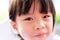 Close up of adorable Asian child happy face. Kids sweet smile. Children looks at camera. Baby aged 3-4 years old
