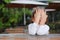 Close-up of adorable little Asian child girl expressed disappointment or displeasure on the wood table