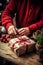 Close-up adult person hands wrapping a Christmas gift