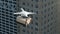 Close-up Aerial Drone Flying with Delivering Package Shipment in City Lopping