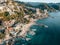Close-up aerial view of Conchas Chinas Beach and it nearby hotels in Puerto Vallarta Mexico