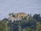 Close up aerial view on Monastary Panagias Paleokastritsa near popular turquoise beach of Agios Spyridonas, Corfu island, Ionian,