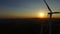 Close up aerial view of windmill blades at sunset