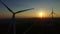 Close up aerial view of windmill blades at sunset