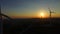 Close up aerial view of windmill blades at sunset