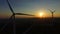 Close up aerial view of windmill blades at sunset