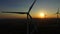 Close up aerial view of windmill blades at sunset