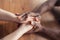 Close up of african-american male and caucasian female hands holding