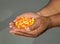 Close up of African American man`s hands holding Halloween candy corn