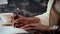 Close up of african american woman`s hands signing agreement