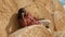 Close up, African black farmer sitting on the haystack and having a phone call