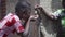 Close-up of African Black Girl Drinking Potable Water outdoors, candid slow motion video