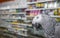 Close up African grey parrot Psittacus erithacus portrait in store. Bird listening to customer and offering goods. Face scene of